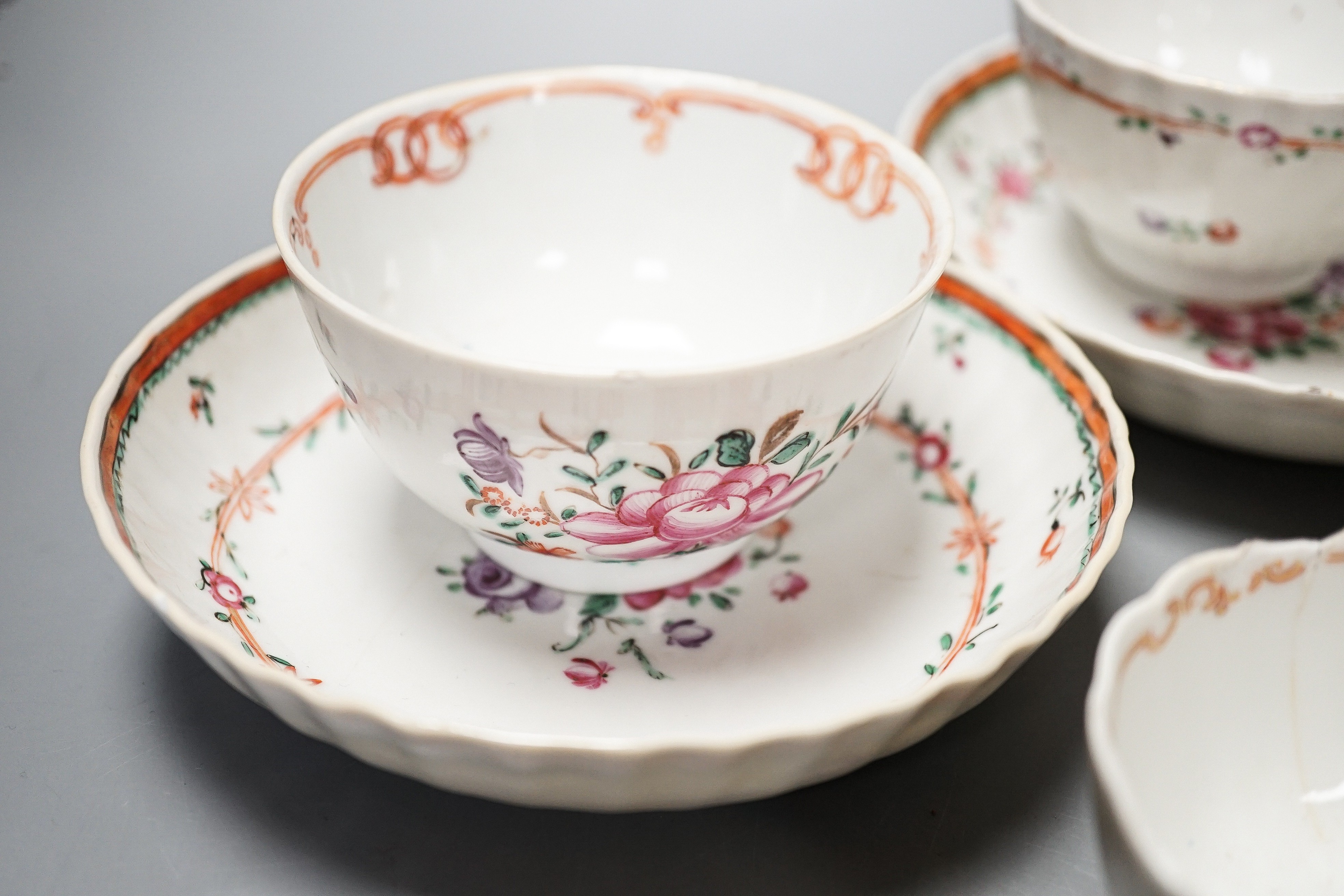 Three Chinese export famille rose tea bowls and two saucers, three Staffordshire porcelain cottage pastille burners and an English porcelain cream boat